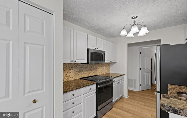 Photo - Welcome to Piney Orchard! This beautifully updated 2-bedroom, 2-bath condominium!