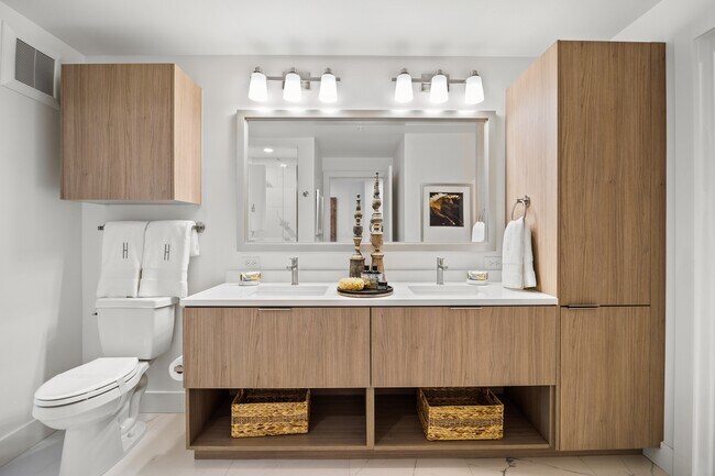 Spa-inspired bathroom offering ample storage space