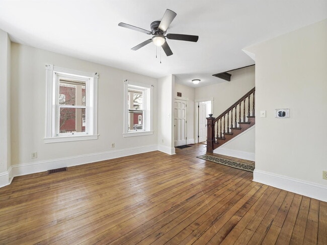 Photo - Charming 3-Bedroom Single-Family Home with Wrap-Around Porch & Private Fenced Yard