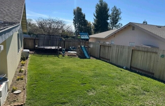 Photo - 3 bedroom 2 bath home with bonus room close to schools and shopping. Rv and or boat parking.