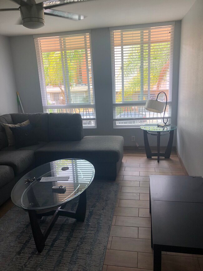 Living Room- Includes sectional, tables and lamps