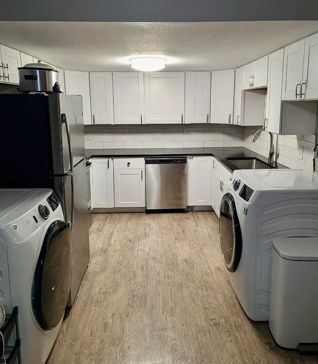 Photo - Beautifully Renovated 3 Bedroom Apartment with Private Balcony, In-Unit Laundry & A/C Unit 5