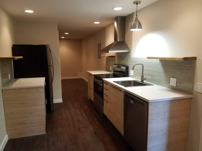 Galley kitchen with stainless steel appliances - 1610 SW Freeman St Unit Apt B