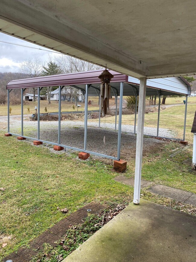 Covered parking. - 152 Madden Rd