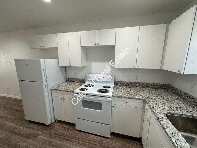 Photo - Spacious and updated 2 bedroom 2 bathroom apartment for rent. Central heat and air, granite count...