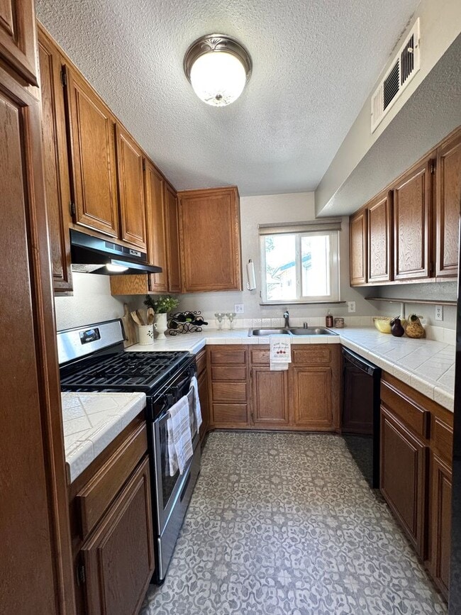 Photo - Charming 2 bed 1.5 bath condo, with attached 2 car garage!
