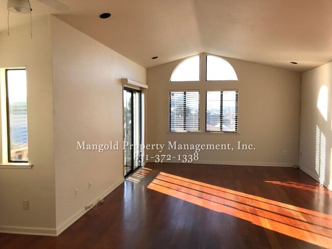 Photo - Charming Two-Story 2-Bed 2-Bath Home with Wrap-Around Balcony & Hardwood Floors in Seaside