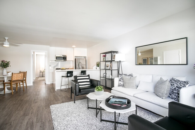 Park View on Yukon fully furnished living room and kitchen - Park View on Yukon Apartments