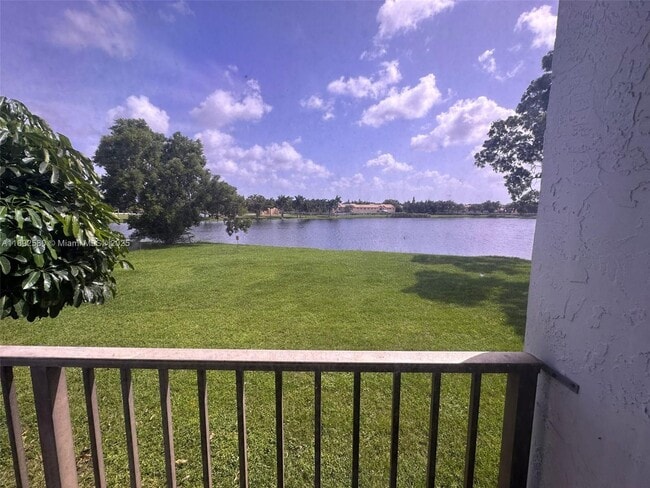 Building Photo - 8560 N Sherman Cir Unit 202