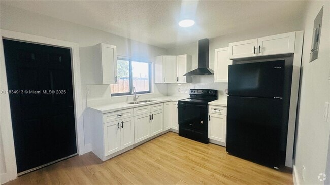 Building Photo - 3621 NW 23rd Ct Unit 3623 Rental