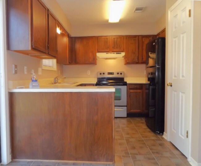 Photo - -Bed, 1.5-Bath Duplex in Bellview with Garage, Indoor Laundry, and Private Fenced Backyard