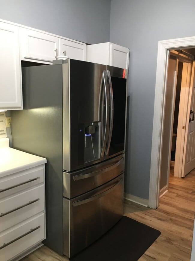 Photo - Midtown 2 story condo. Over 1200 sq ft of living space! Fenced in back yard! Pets are owner's app...