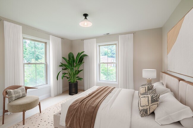 Welcome to Waterfront at the Strand, where modern elegance meets comfort. This stunning bedroom features large windows for ample natural light, stylish décor, and a serene atmosphere. Schedule your visit today and see your future home!