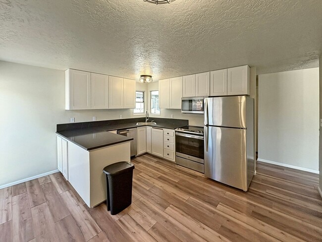 Photo - 3-Bedroom Boise Home with Outdoor Fireplace, Fenced Yard & LVP Flooring Near Downtown | $500 Off ...