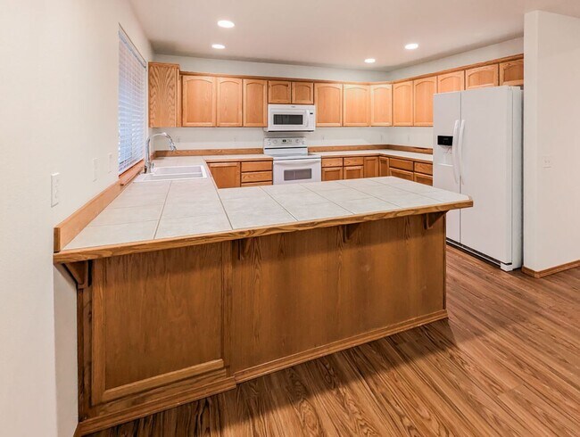 Photo - **Move-in Special!!!** Spacious 4 bd, 2.5 ba with 2 car garage and fenced yard!