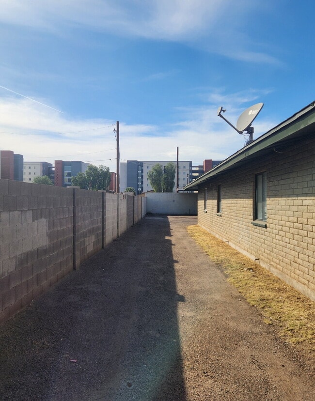 Photo - FIRST FLOOR LIVING WITH OPEN KITCHEN, DEN & CARPORT – GCU ACCESS Unit 1