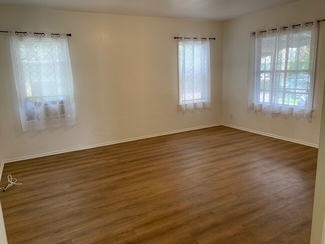 Spacious living room filled with natural light - 4092 Howard Ave