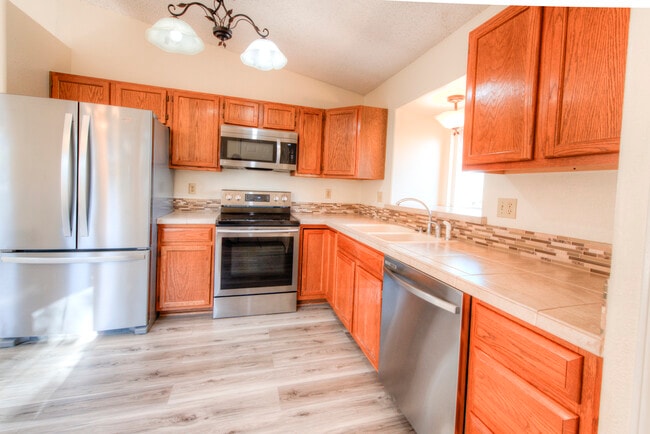 Newer stainless steel appliances bookend the kitchen. - 2875 Richmond Dr