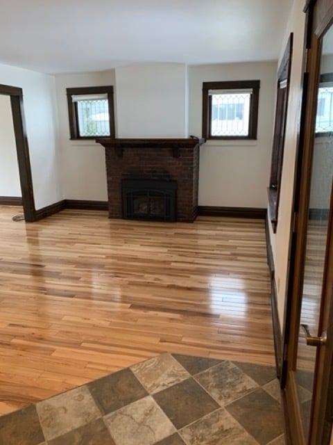 living room with gas fireplace - 1818 E 7th St