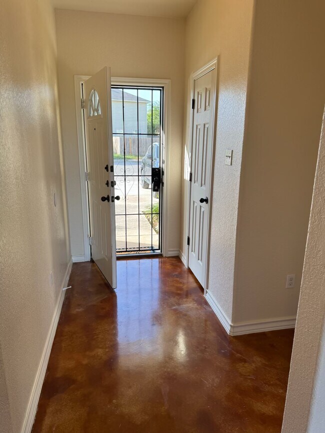 Entry way with 1/2 bath to the left as you enter