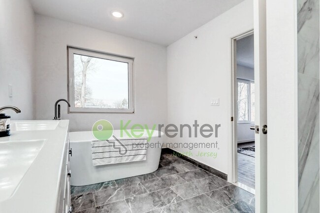 Photo - Brand New End-Unit 3-Bedroom Townhome with Garage, Driveway & EV Charger – First Occupancy!