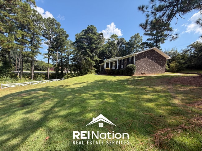 Photo - MASSIVE BESSEMER RENTAL! 4BR/2.5BA | High Ceilings & Brick Fireplace | 2-Car Garage!