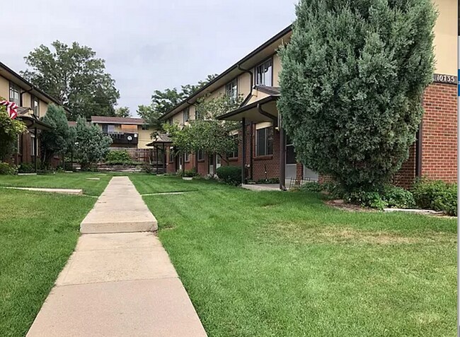 Experience serene living with this beautiful apartment courtyard, perfect for relaxation and enjoying nature. - 10756 West 12th Lane