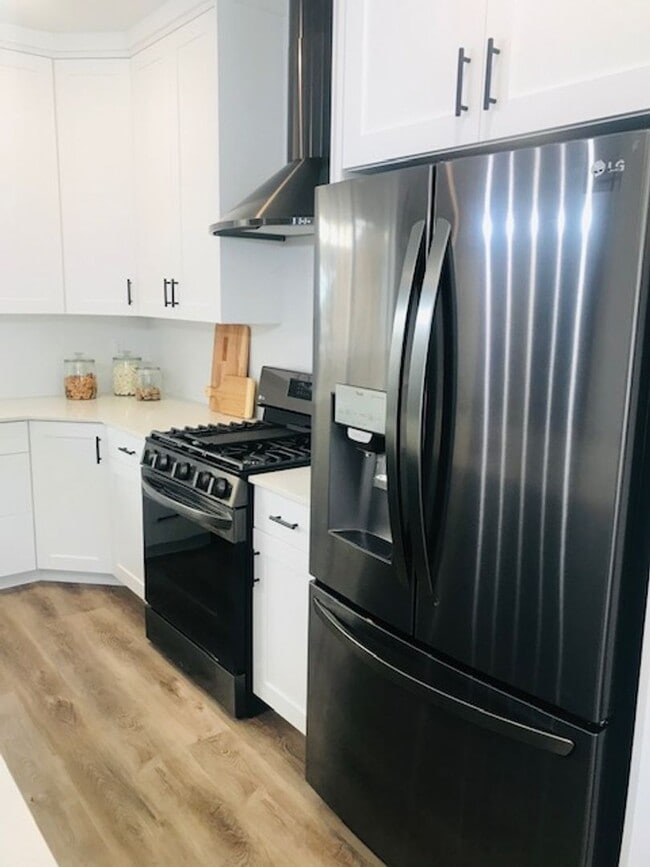 Photo - Beautiful new construction townhouse with quartz countertops and 2 car garage