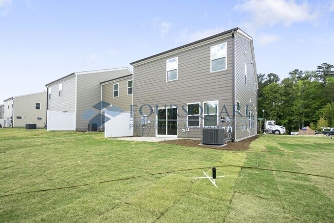 Photo - End-Unit Townhome with Loft, Open Floor Plan & Patio, Conveniently Located Near Dining, Shopping,...