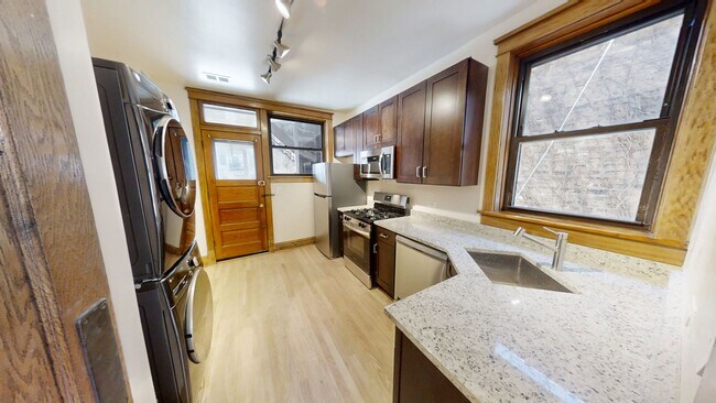 Photo - Lakeview Gem: 2 Bed, 1 Bath W/ In-Unit Laundry, D/W, Cent Air, Fireplace, Deck, Parking! Unit 1417-1