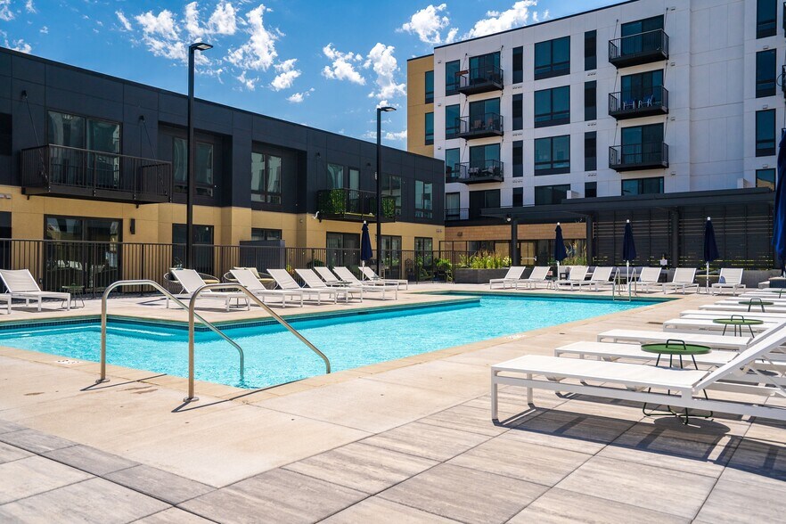 Dive into resort-style living with a sparkling pool and plenty of lounge seating.