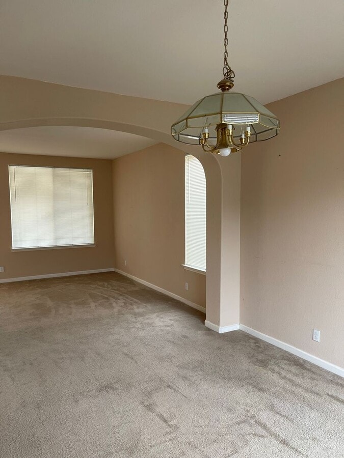 Photo - Spacious two-story home available for rent featuring 4 bedrooms, 2.5 bathrooms, and a three-car g...