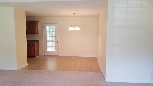 Photo - Charming Home with Covered Back Deck and Fenced in Yard...