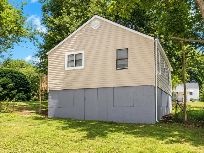 Photo - Bright 3-Bedroom Home with Covered Porch, Fireplace & Wooded Backyard