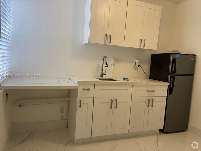 Building Photo - 875 W 77th St Unit A Rental