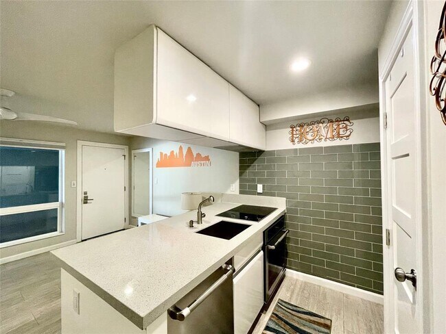 Building Photo - 3110 Red River St Unit D-107