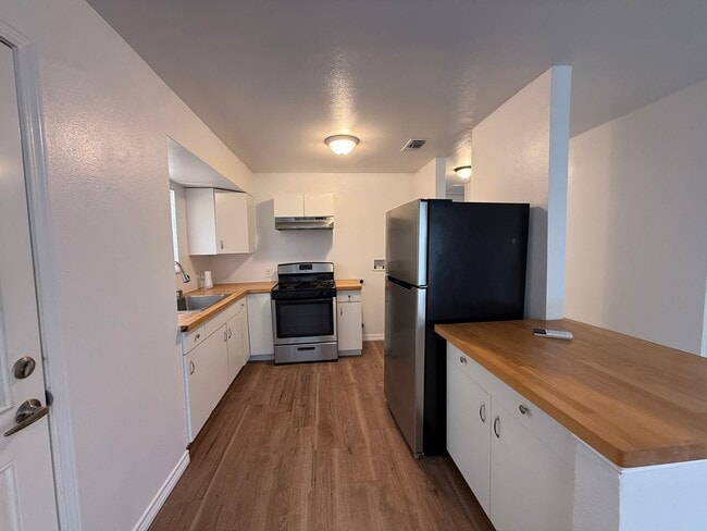 Photo - Charming 3-Bedroom Home with Hardwood Floors & Spacious Backyard