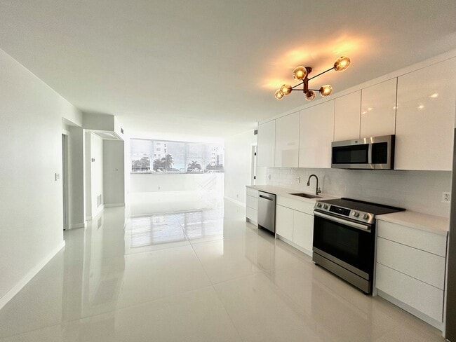 Photo - Fully Renovated East-Facing 2BR/2BA + Bonus Room | Ocean Views | In-Unit W/D Unit 401