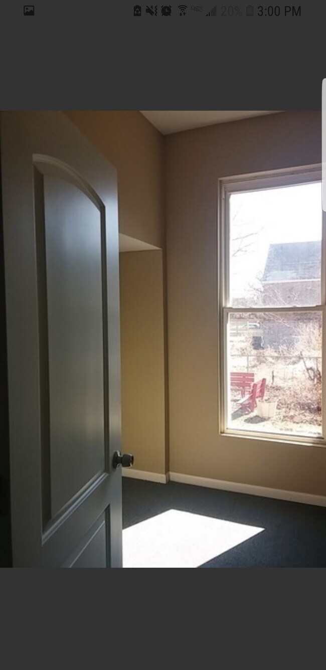 First bedroom. Window faces community garden. - 2115 S Central Park Ave Unit 2