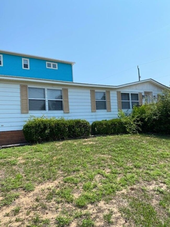 Photo - Introducing a charming 3-bedroom, 2-bathroom house located in the desirable Carolina Beach, NC.