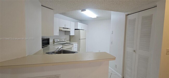 Photo - 9001 Wiles Rd Unit 103-3