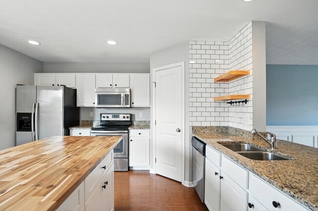 Kitchen with large pantry - 6169 Needletail Rd Unit 6169 Needletail Rd