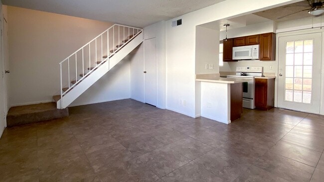 Photo - Great 3 bedroom and 1.5 bath townhouse with a small yard and 2 car garage.