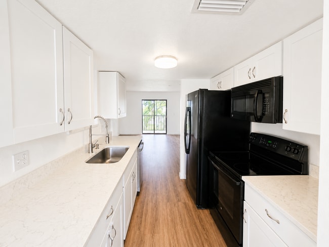 Photo - Updated 2-Bedroom Condo with Screened Lanai with water included.