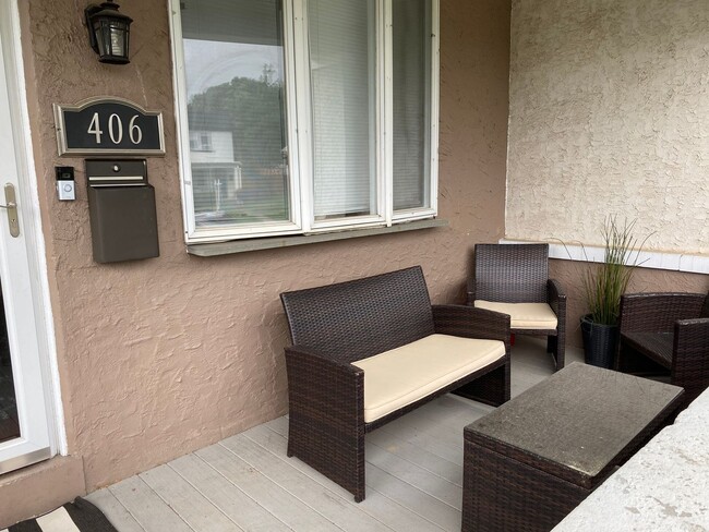 Photo - 3BR Twin Home | Hardwood Floors • Fenced Yard • Garage • W/D Included