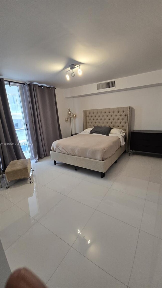 9195 Collins Ave Unit 406