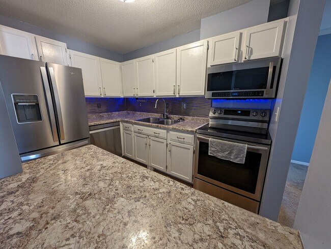 Photo - Updated 2bd/1ba Condo w/ Pool & Heated Par...