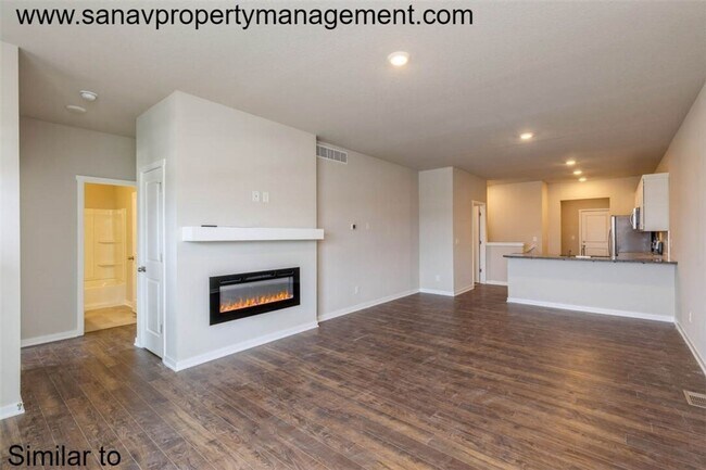 Photo - Modern Charm: 2-Bedroom, 2-Bathroom Home with Open Floor Plan and Rear Load Garage