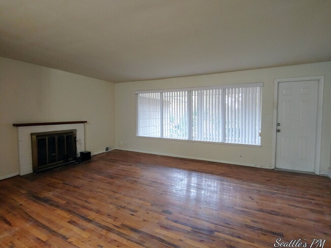 Photo - "Charming 2-Bed Retreat with Gleaming Hardwood Floors in Prime Seattle Location!"