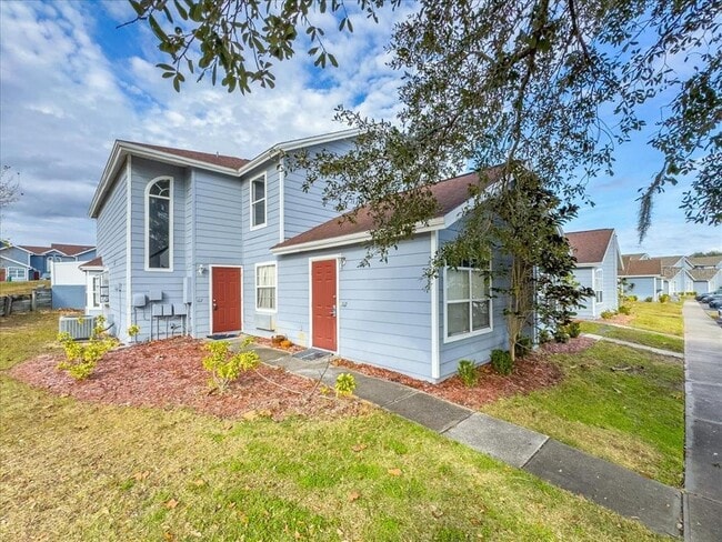 Building Photo - 102 Mango Dr Unit Front